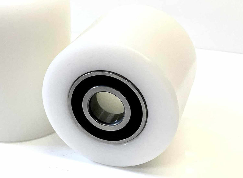 Close-up of durable pallet truck parts including wheels, axles, and forks for warehouse equipment maintenance